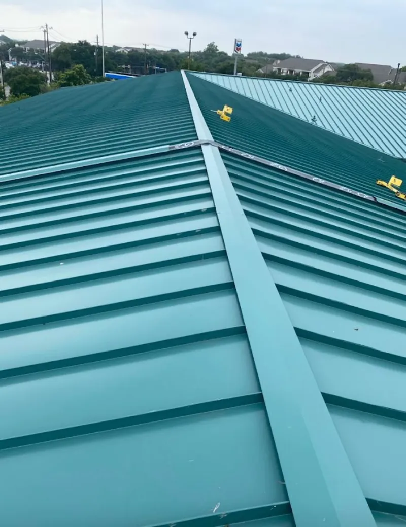 Green commercial metal roof ridge and valley for Metal Roof Repair in Lower Salford